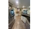 Modern kitchen features stainless steel fridge, granite countertops, and plenty of cabinet space at 10505 Winding Wood Trail Trl, Raleigh, NC 27613