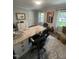 Inviting office featuring a granite-topped desk, neutral color scheme, and abundant natural light at 10505 Winding Wood Trail Trl, Raleigh, NC 27613