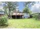 Exterior view of a home with a wooden deck and lush lawn at 106 Eugene St, Carrboro, NC 27510