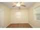 This empty bedroom has wood flooring, natural light and neutral paint, awaiting your personal touch at 106 Eugene St, Carrboro, NC 27510