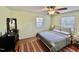 Comfortable bedroom with ceiling fan, neutral walls, and natural light at 106 Eugene St, Carrboro, NC 27510