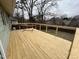 Spacious outdoor deck with wood flooring, metal and wood railing, and hammock at 106 Eugene St, Carrboro, NC 27510