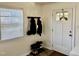 Bright entryway with natural light, coat rack, shoe rack, and a white door at 106 Eugene St, Carrboro, NC 27510