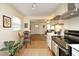 Open kitchen layout leading to the living room and featuring stainless steel appliances at 106 Eugene St, Carrboro, NC 27510