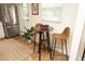 Cozy kitchen nook with a bistro table set, natural light, and stainless steel appliances for modern comfort at 106 Eugene St, Carrboro, NC 27510