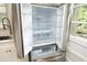 Stainless steel refrigerator with a door open to reveal an organized interior, perfect for a modern kitchen at 106 Eugene St, Carrboro, NC 27510