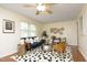 Cozy living room with a plush rug, stylish furniture, and warm natural light creating an inviting space at 106 Eugene St, Carrboro, NC 27510