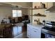 Open-concept living room with hardwood floors with adjacent kitchen and dining area at 106 Eugene St, Carrboro, NC 27510