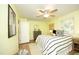 Bright bedroom with a ceiling fan, hardwood floors, and comfortable furnishings, offering a serene retreat at 106 Eugene St, Carrboro, NC 27510