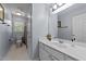 Bright bathroom with modern vanity, mirror, and white tile at 106 Wolverton Dr, Clayton, NC 27527