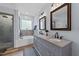Elegant bathroom with a double vanity, granite countertops, and separate shower and tub at 106 Wolverton Dr, Clayton, NC 27527