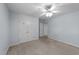 This bedroom features neutral walls, a ceiling fan, and a spacious closet at 106 Wolverton Dr, Clayton, NC 27527