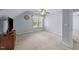 Bedroom features neutral walls, carpeted floor, natural light, and ceiling fan at 106 Wolverton Dr, Clayton, NC 27527