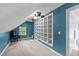 Versatile bonus room with a built-in bookshelf, window, carpet and unique architecture at 106 Wolverton Dr, Clayton, NC 27527