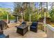 Cozy backyard deck with comfortable seating, string lights, and a fire pit at 106 Wolverton Dr, Clayton, NC 27527