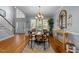 Bright dining room featuring a modern chandelier and large windows overlooking the yard at 106 Wolverton Dr, Clayton, NC 27527