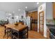 Bright kitchen with a large island, stainless steel appliances, and hardwood floors at 106 Wolverton Dr, Clayton, NC 27527