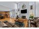 Spacious living room with fireplace, hardwood floors, and an abundance of natural light at 106 Wolverton Dr, Clayton, NC 27527