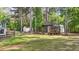 View of a backyard outbuilding with a porch and railing at 106 Wolverton Dr, Clayton, NC 27527