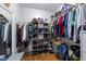 Well-organized walk-in closet with ample shelving, hanging space, and hardwood floors at 106 Wolverton Dr, Clayton, NC 27527