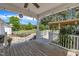 Covered back porch with view of landscaped yard and string lights at 1112 Turner Farms Rd, Garner, NC 27529