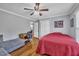 Bedroom with hardwood floors, ceiling fan, and attached ensuite with double closets at 1112 Turner Farms Rd, Garner, NC 27529