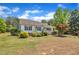 Beautiful front yard featuring a well-maintained lawn and mature trees surrounding the property at 1112 Turner Farms Rd, Garner, NC 27529