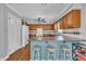 A lovely kitchen with wooden cabinets, a blue center island, and stylish barstools at 1112 Turner Farms Rd, Garner, NC 27529