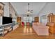 Bright and airy living room with hardwood floors, brick fireplace, and stylish furniture at 1112 Turner Farms Rd, Garner, NC 27529