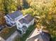 Aerial view of the property showcasing its location in a neighborhood with mature trees at 117 Idlewild Ave, Raleigh, NC 27601