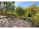Landscaped backyard features a charming brick patio perfect for entertaining and relaxing at 117 Idlewild Ave, Raleigh, NC 27601