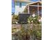 Close-up of the backyard patio area with blooming rose bushes and covered porch at 117 Idlewild Ave, Raleigh, NC 27601
