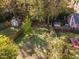 Expansive backyard featuring a grassy lawn, fenced perimeter, and mature trees at 117 Idlewild Ave, Raleigh, NC 27601