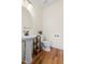 Bathroom with pedestal sink, modern fixtures, and hardwood floors at 117 Idlewild Ave, Raleigh, NC 27601