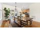Cozy dining space with hardwood floors, a rustic table, and views to the backyard at 117 Idlewild Ave, Raleigh, NC 27601