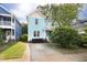 Charming two-story home with a well-maintained front yard and a concrete driveway at 117 Idlewild Ave, Raleigh, NC 27601
