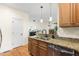 A kitchen with granite countertops and an open view of the living space at 117 Idlewild Ave, Raleigh, NC 27601
