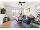 Inviting living area with natural light, comfortable seating, and a modern ceiling fan at 117 Idlewild Ave, Raleigh, NC 27601