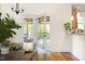 A dining area looking out onto the screened porch with comfortable lounge furniture at 117 Idlewild Ave, Raleigh, NC 27601