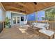 Stylish screened porch with lounge seating, hammock, and outdoor games for entertaining at 117 Idlewild Ave, Raleigh, NC 27601