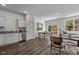 Open-concept living room showcases wood floors, natural light, kitchen, and dining area at 117 N Chubb Rdg, Wilson's Mills, NC 27520