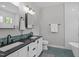 Stylish bathroom featuring double sinks, mosaic tile floor, subway tiled walls, and a soaking tub at 120 Avent Pines Ln, Holly Springs, NC 27540