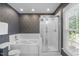 Bathroom featuring a tub, shower, toilet, and a window with natural lighting at 120 Avent Pines Ln, Holly Springs, NC 27540