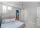 This comfortable bedroom provides a ceiling fan and a large window for plenty of natural light at 120 Avent Pines Ln, Holly Springs, NC 27540