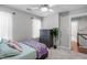 Comfortable bedroom featuring a ceiling fan, dresser, and natural lighting at 120 Avent Pines Ln, Holly Springs, NC 27540