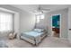 This cozy bedroom offers a ceiling fan and ample natural light for a soothing atmosphere at 120 Avent Pines Ln, Holly Springs, NC 27540