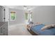 Cozy bedroom with natural lighting, a ceiling fan, and a comfortable bed at 120 Avent Pines Ln, Holly Springs, NC 27540