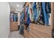 Walk-in closet provides ample storage space with custom shelving and built-in drawers at 120 Avent Pines Ln, Holly Springs, NC 27540