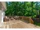 Wooden deck with furniture and surrounded by forest at 120 Avent Pines Ln, Holly Springs, NC 27540