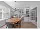 Dining room features a table, view to the kitchen, and an adjacent Gathering room at 120 Avent Pines Ln, Holly Springs, NC 27540